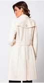 Close-up of beige jacquard trench coat fabric showing subtle textured detail. Luna Fashion House