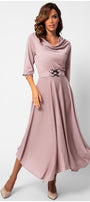 Woman wearing a pink dress with a belt on a white background Luna Fashion House