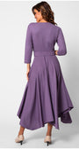 Woman wearing a purple dress with a fitted bodice and flowing skirt on a white background Luna Fashion House