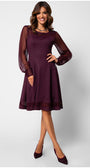 Woman wearing a burgundy dress with sheer sleeves on a white background Luna Fashion House