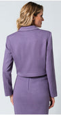 Woman wearing a purple suit on a light gray background Luna Fashion House