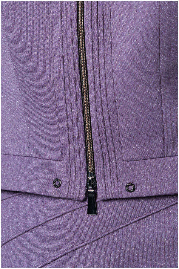 Close-up of a purple jacket with a zipper and button details. Luna Fashion House