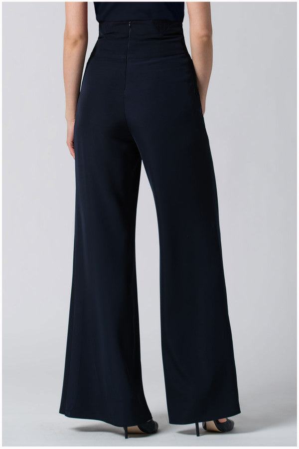 Back view of high-waisted Tailored Wide Leg Pants  wide-leg black Greta pants made from premium viscose blend fabric on a model