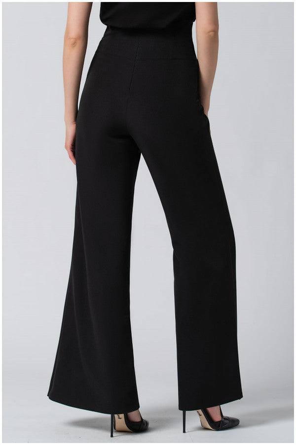 Rear view of black high-waisted tailored wide leg pants Greta made from premium viscose blend, paired with black heels.