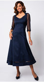 Woman wearing a navy blue dress with sheer sleeves on a white background Luna Fashion House