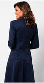 Woman wearing a navy blue suit on a light gray background