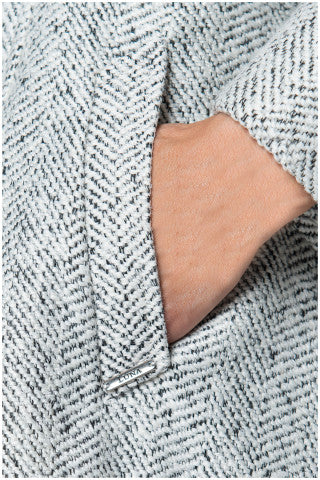 Close-up of a textured fabric with a brand label visible