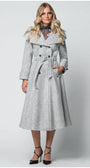 Woman wearing a long gray coat with a belt on a white background