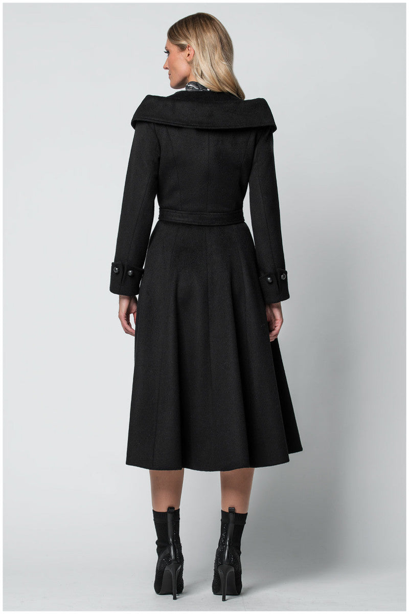 Woman wearing a black Luna Fashion House coat from behind on a light gray background