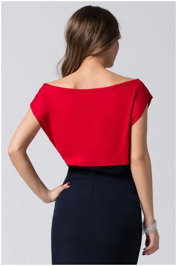 Woman wearing red and black Top Greta with bold red bodice and black waistline, showcasing smooth drape and elegant silhouette from the back