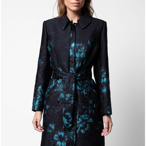 Woman wearing a black coat with blue floral patterns on a white background Luna Fashion House design