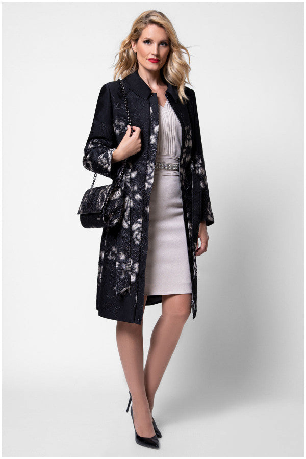 Woman wearing a black floral coat over a white dress on a white background  Luna Fashion House design