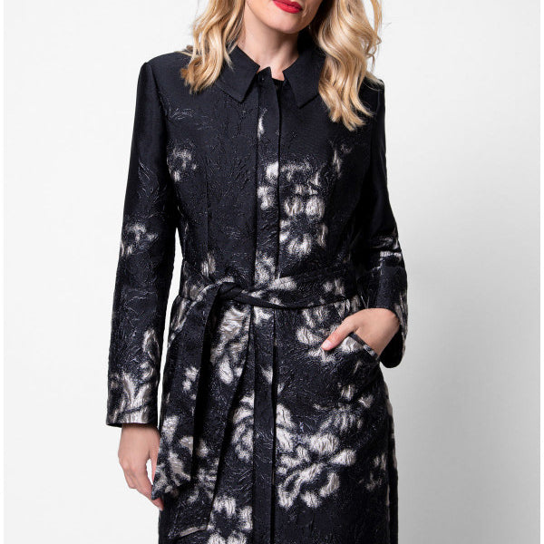 Woman wearing a black floral coat against a white background Luna Fashion House design