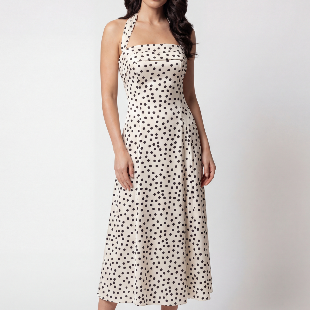 White satin strapless midi dress with black polka dots, corset bodice, A-line skirt, worn with the strap around the neck