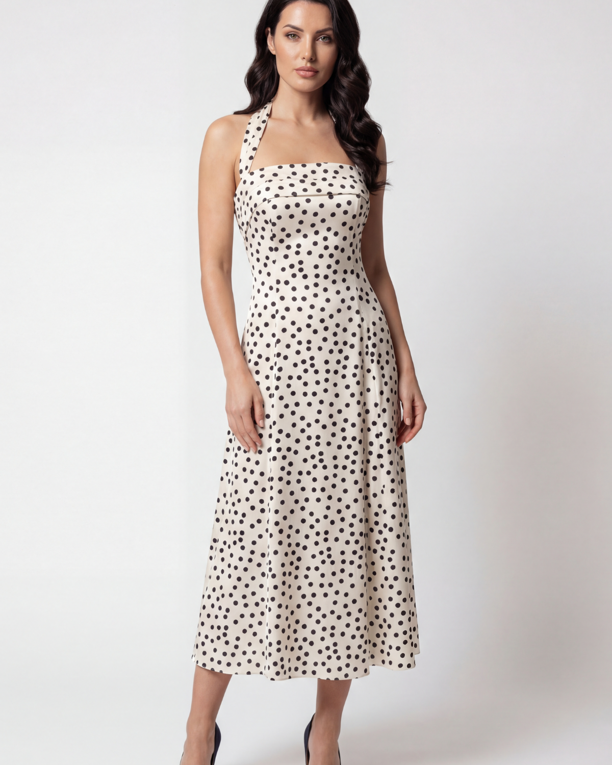 White satin strapless midi dress with black polka dots, corset bodice, A-line skirt, worn with the strap around the neck
