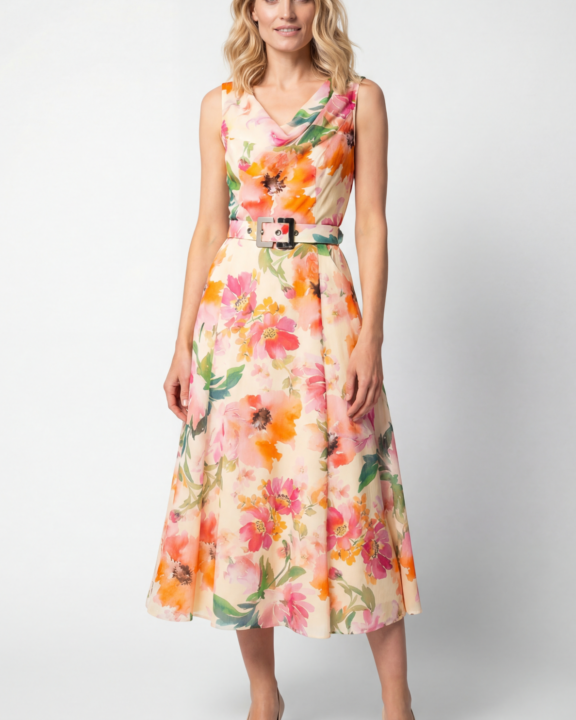 Floor length beige floral lace gown with cap sleeves and fitted bodice on a woman at a formal vow renewal ceremony