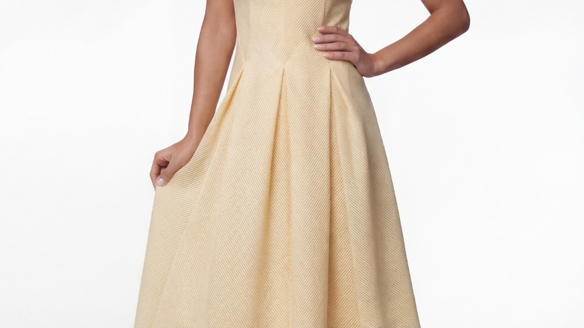 Ivory A-line midi dress with textured fabric and flared skirt, styled for a formal daytime occasion at Luna Fashion House.