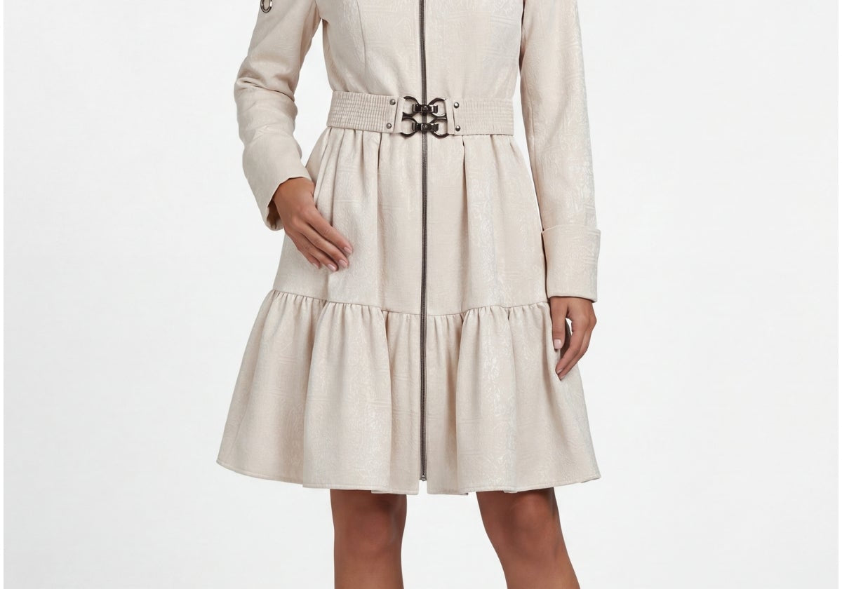 Beige cotton short tailored coat with belted waist and tiered hemline worn over a fall transitional outfit