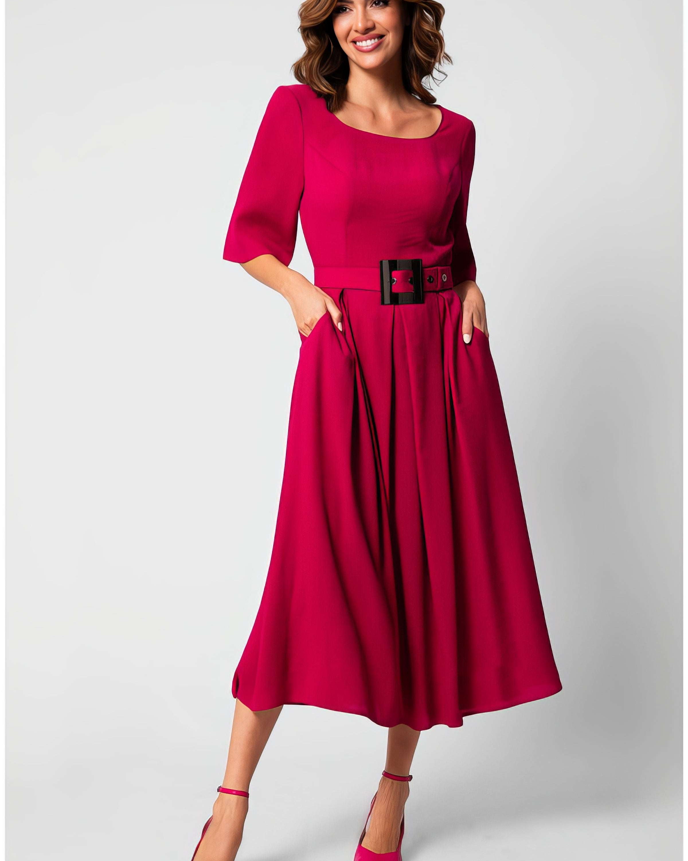 Navy wrap midi dress with short sleeves and adjustable waist tie, shown in a refined European tailoring cut suitable for graduation
