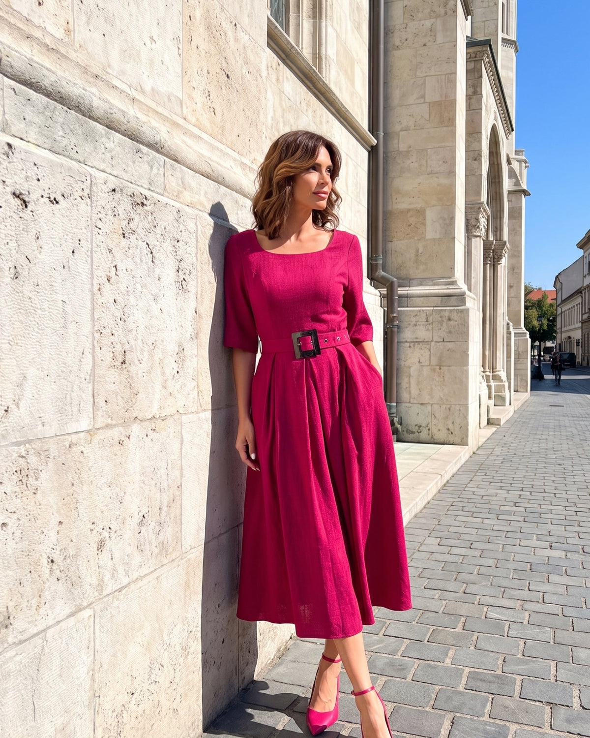 A woman wearing the Luna Charlotte Elegant Midi Dress
