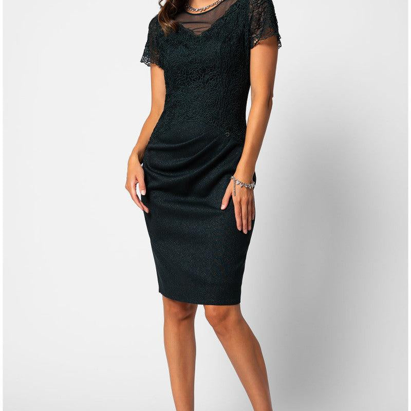 Midnight green lace midi dress with short lace sleeves and soft waist draping, worn as a fall mother of the bride look.