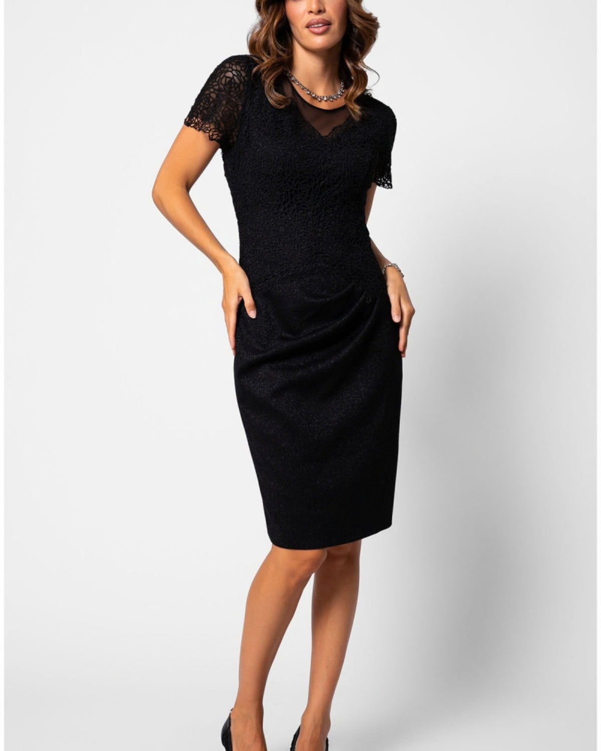 Black lace cocktail dress with sheer sleeves, shown for a guide to buying a dress online