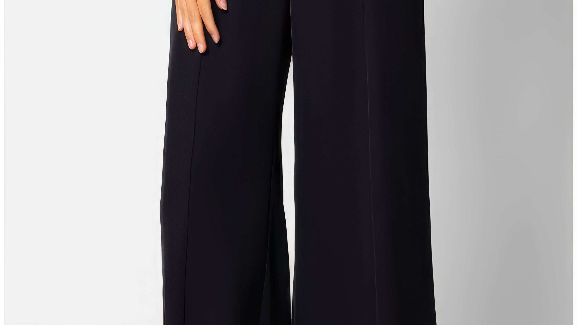 Black high waisted wide leg trousers in fluid tailored crepe with a clean natural waistline and wide fluid leg.