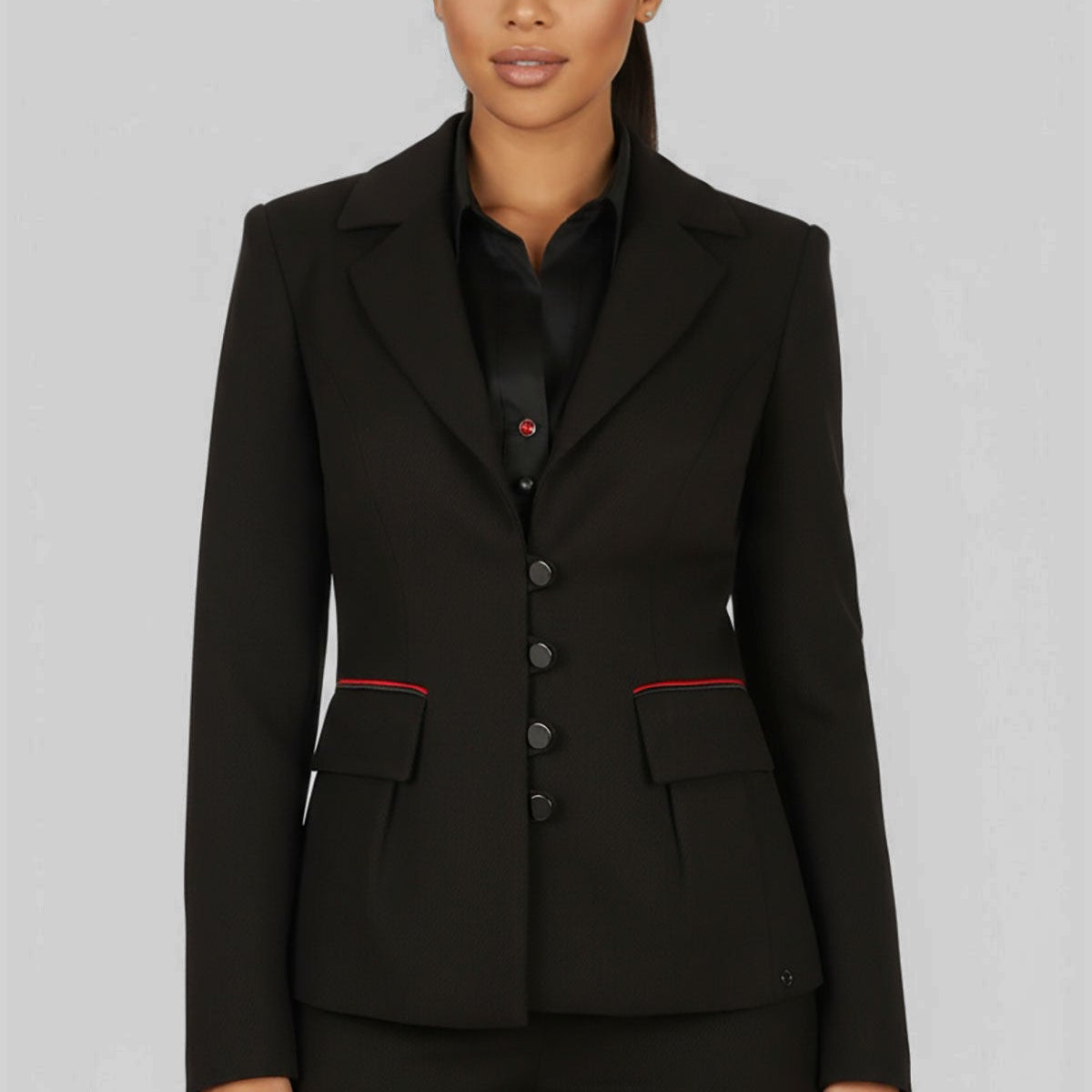 Black tailored blazer with self-tie belt in European cut worn over wide leg black trousers, photographed in a neutral studio setting.