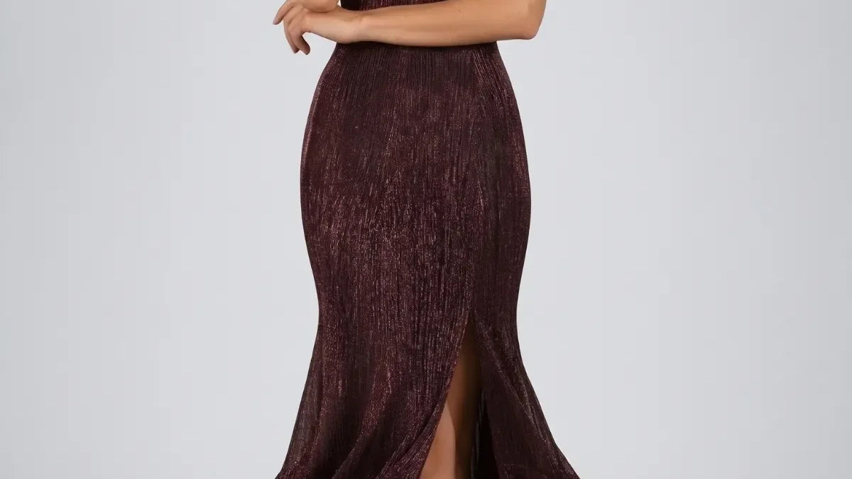Handmade Luna Fashion House occasion wear including a burgundy metallic off-shoulder gown, navy maxi gown, black tailored blazer, and gray herringbone wool wrap coat arranged together