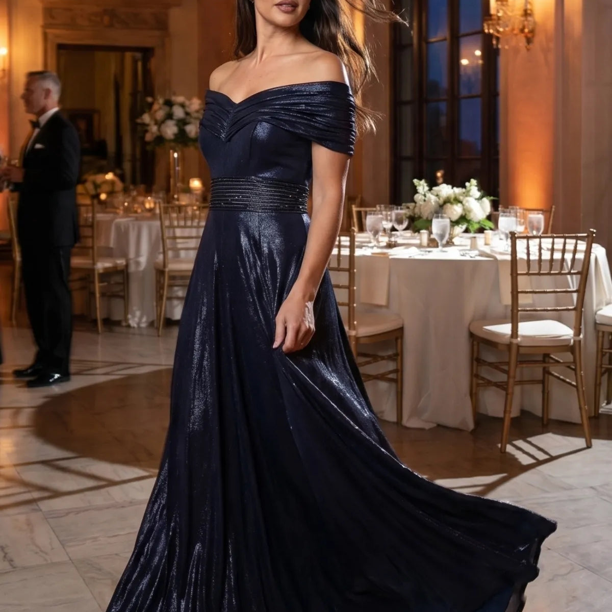Navy off shoulder gown at an evening dinner