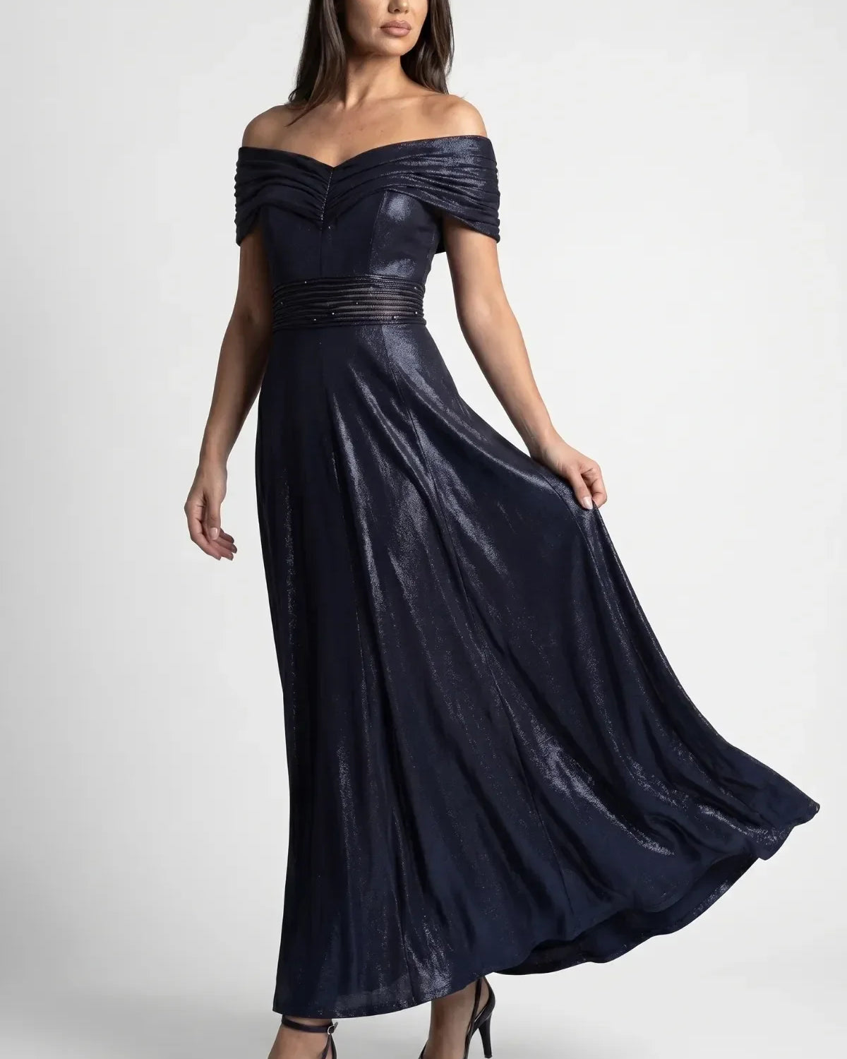 Full length navy off shoulder evening gown with metallic sheen, beaded waist and flowing skirt for a black tie wedding