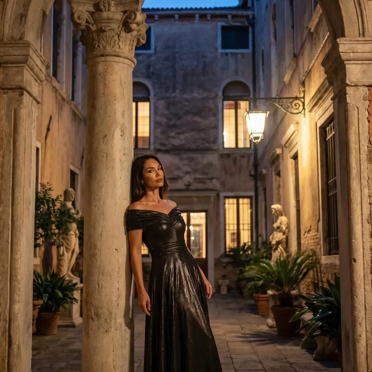 A woman wearing the Luna Iris Off Shoulder Maxi Gown In Anthracite