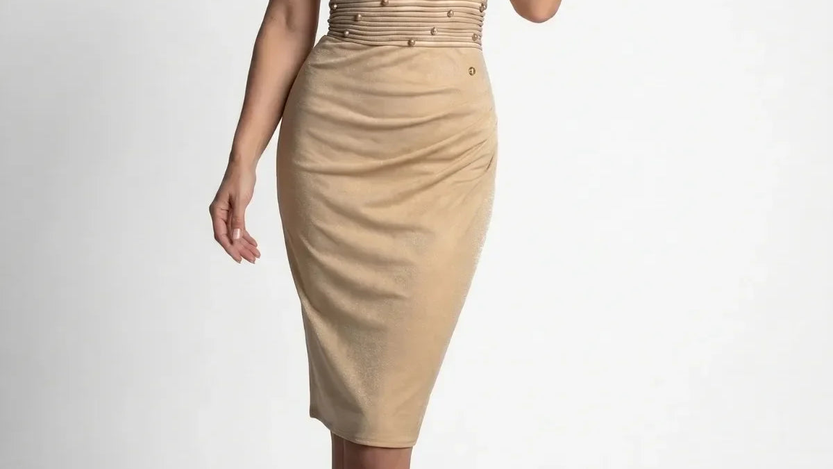 A selection of elegant handmade cocktail wedding guest outfits including a champagne gold off-shoulder dress, a black ruched midi dress, a burgundy lace jumpsuit, and a navy floral two layer jumpsuit displayed against a neutral background
