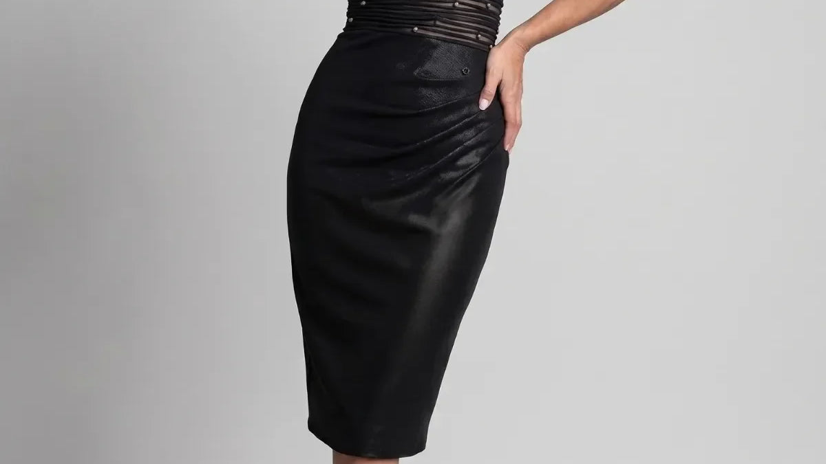 Full-length navy off-shoulder evening gown with beaded waist and flowing skirt in deep navy with subtle metallic sheen
