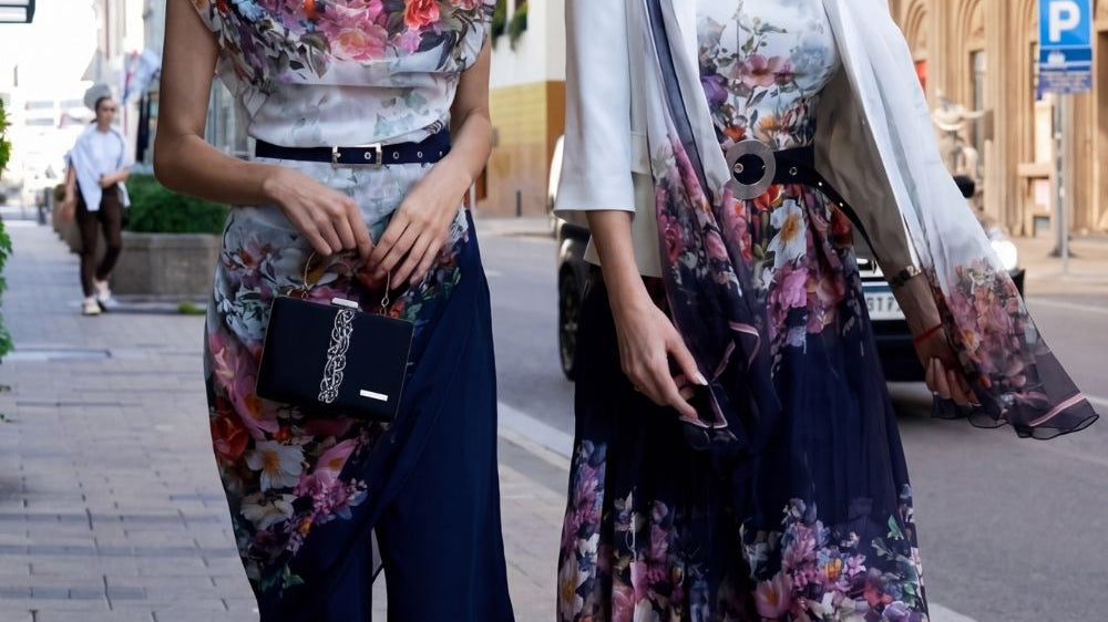 A floral summer dress in a moderate print, cut as a structured midi