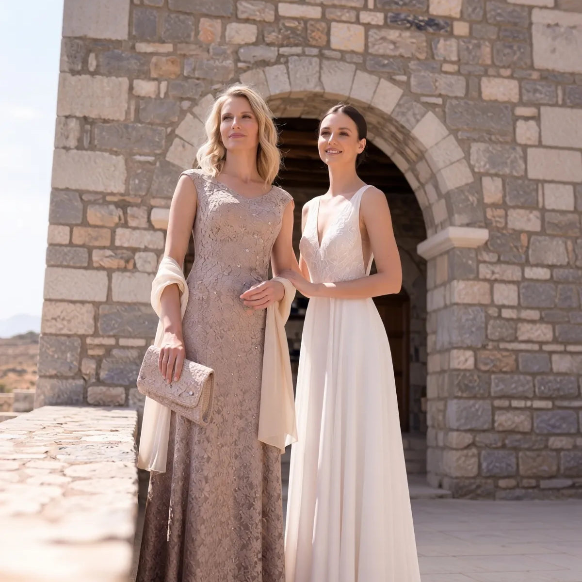 Mother of the bride dress options in ivory and jewel tones on display