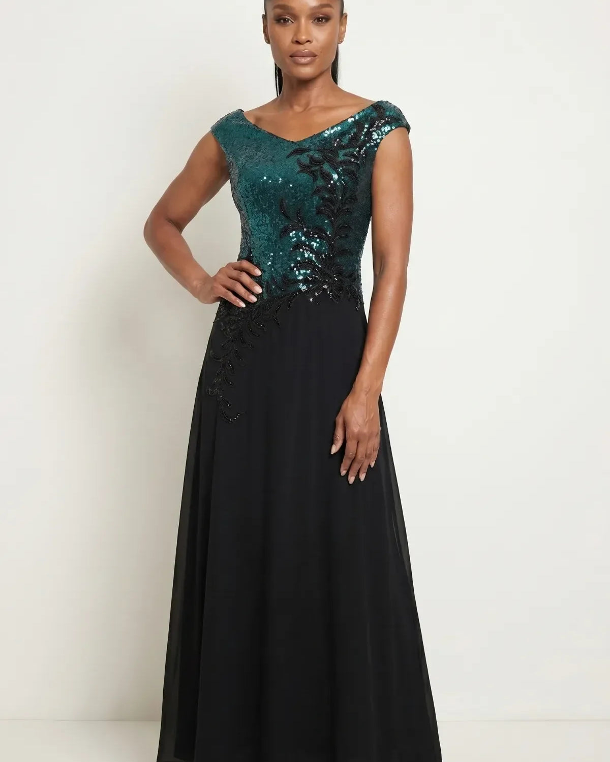 Floor-length evening gown with teal sequined bodice graduating from turquoise to forest green above a flowing black chiffon skirt