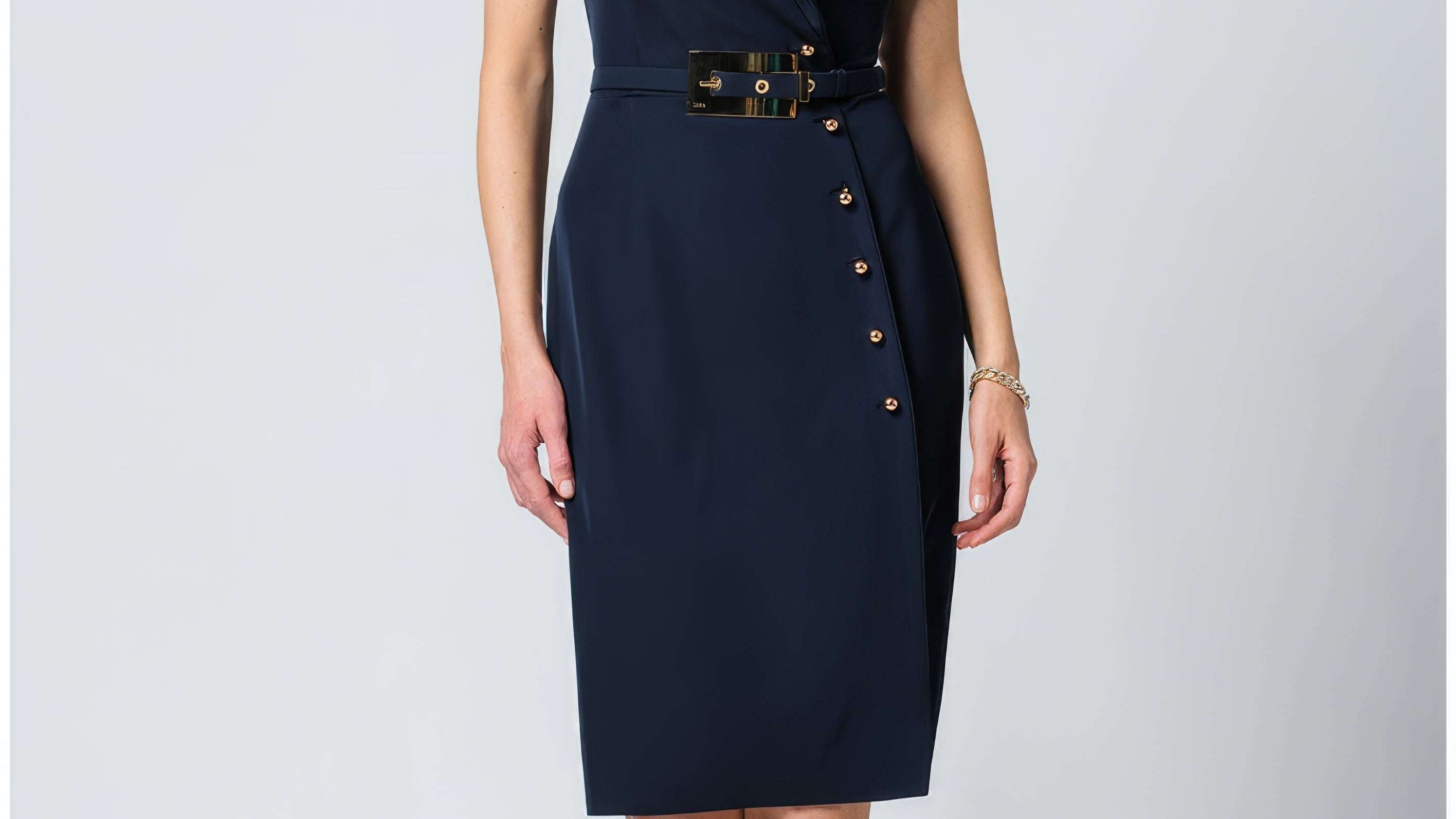 Navy wrap midi dress with short sleeves and a tie waist in rich solid navy, shown on a tailored European silhouette.