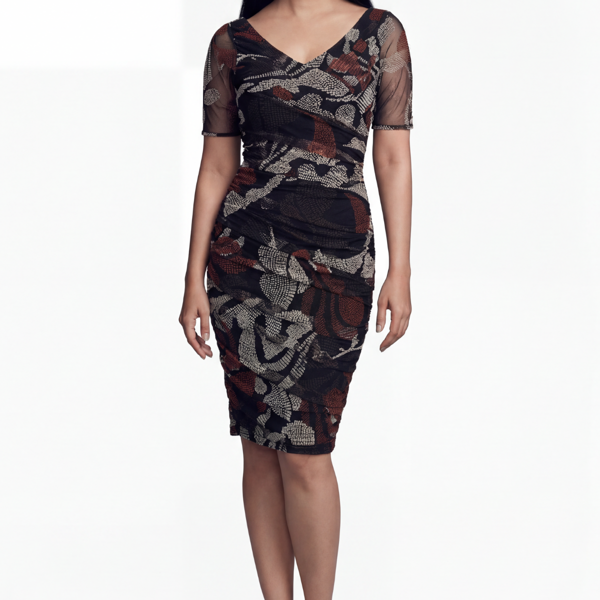 Sleek black fitted midi dress in plant-based silk with tailored waist and clean neckline on a pale studio background