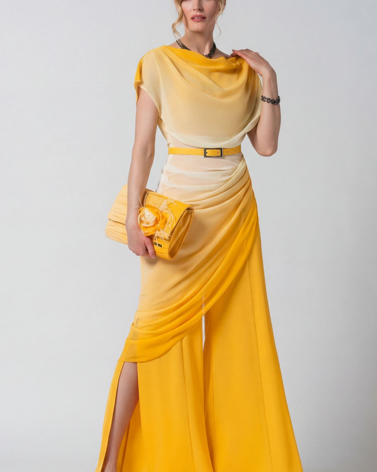 A woman wearing the Luna Tina Jumpsuit In Yellow
