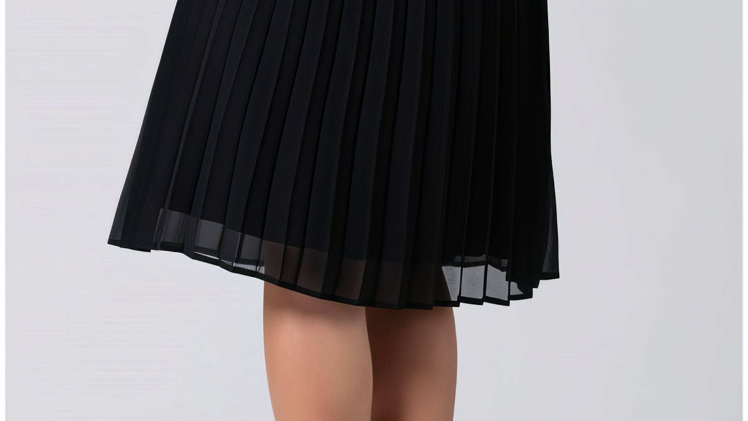 Pleated midi skirt styled for summer with a simple tucked top