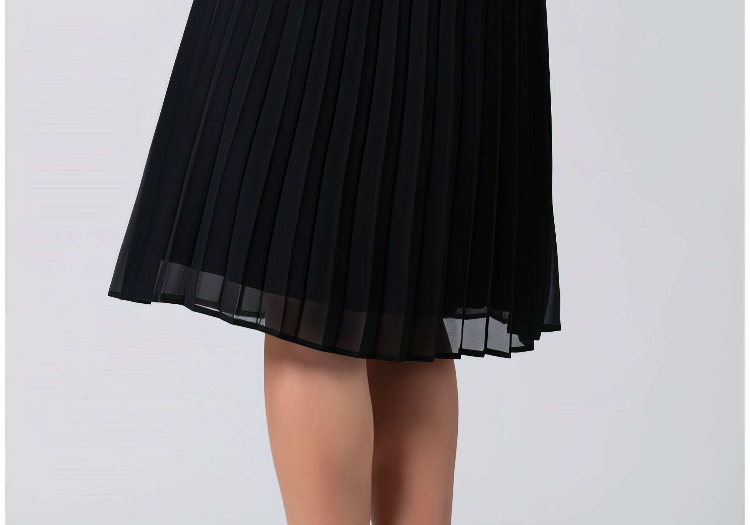 Pleated midi skirt styled for summer with a simple tucked top