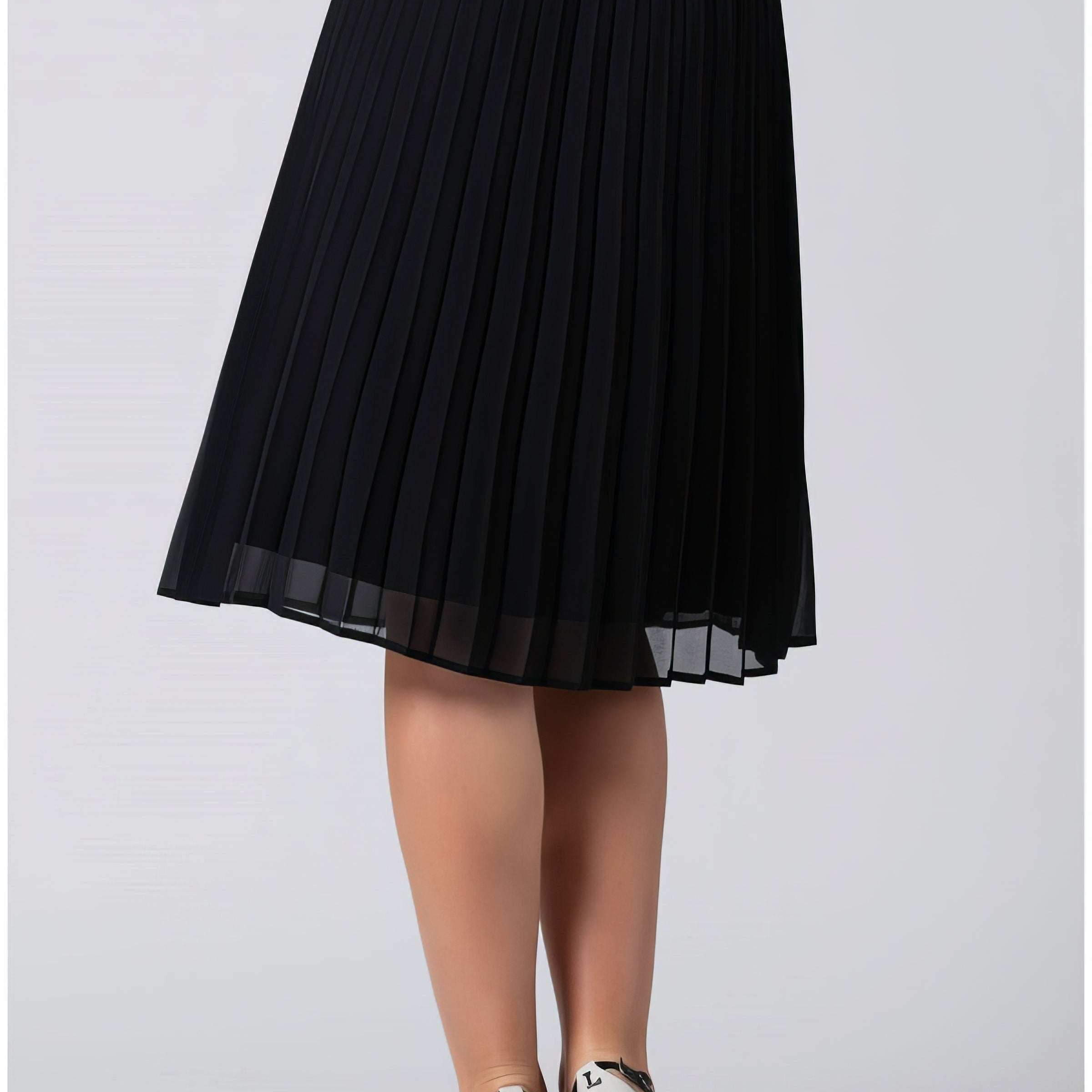 Pleated midi skirt styled for summer with a simple tucked top