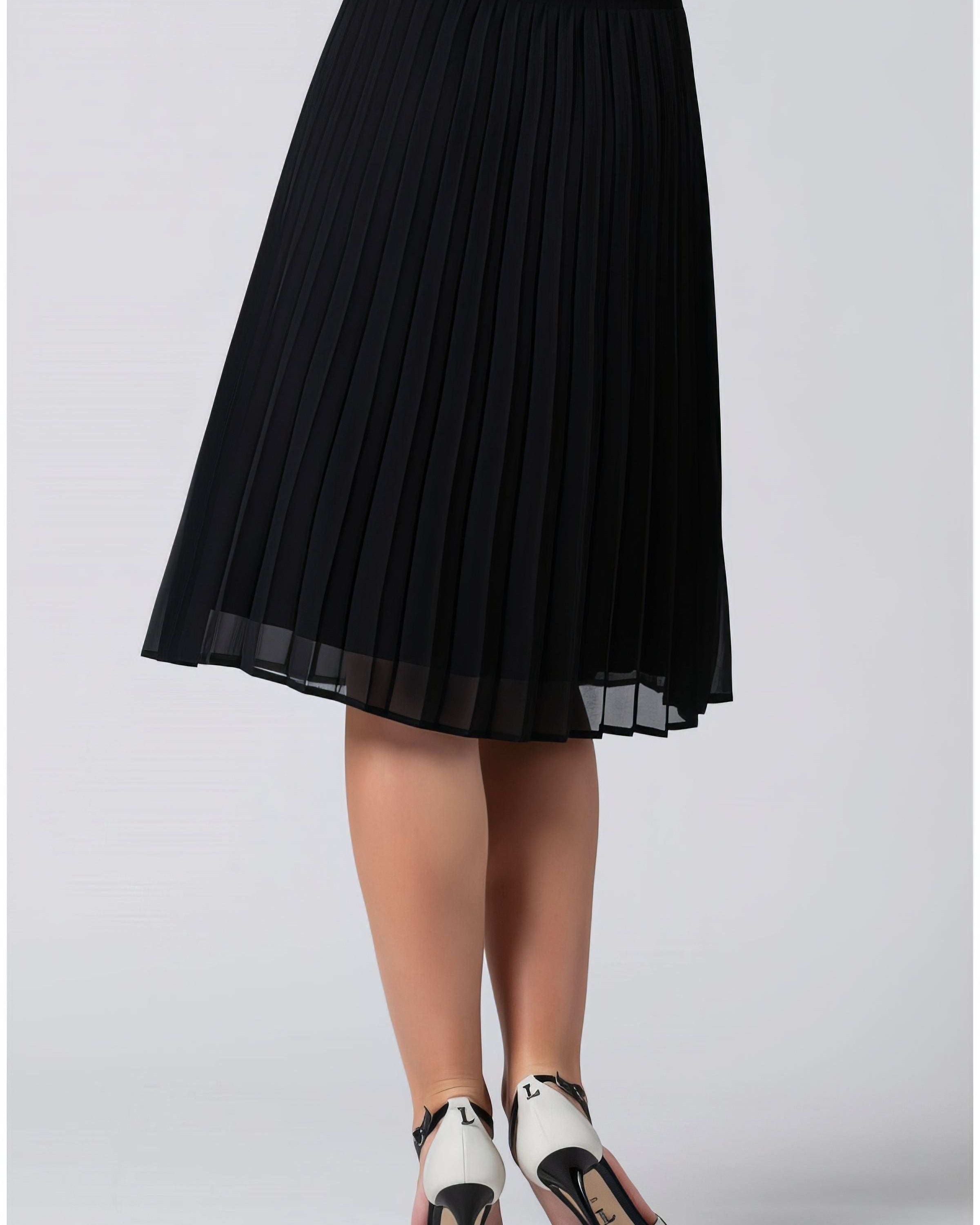 Pleated midi skirt styled for summer with a simple tucked top