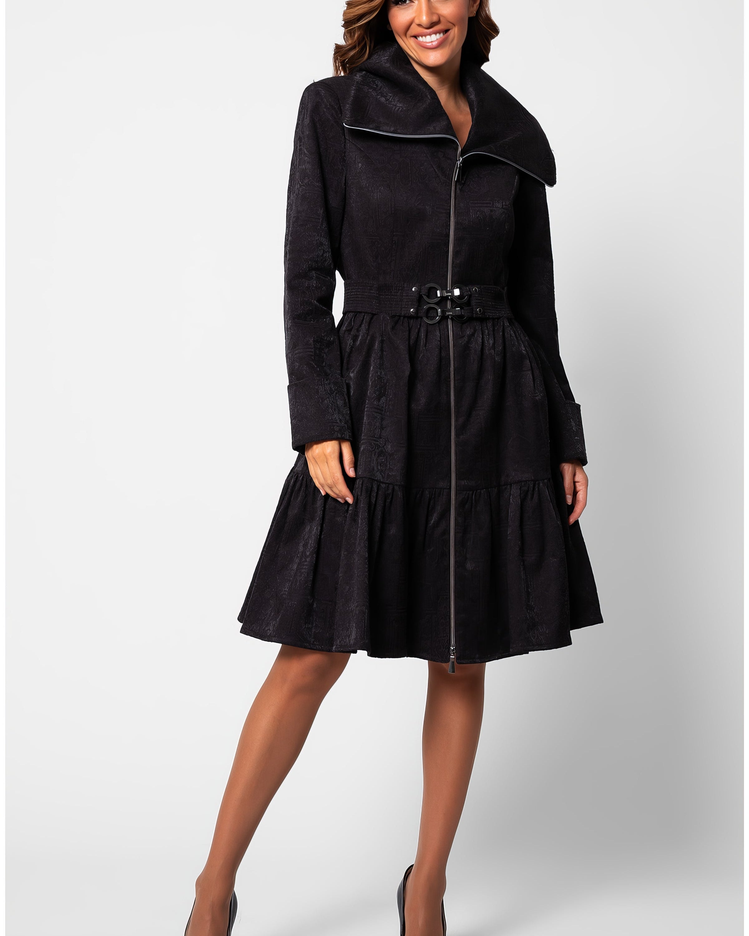 Black short tailored coat, Iris, in a cotton blend with a soft satin finish, wide stand collar, asymmetric zip, buckled belt, and a tiered skirt that ends above the knee