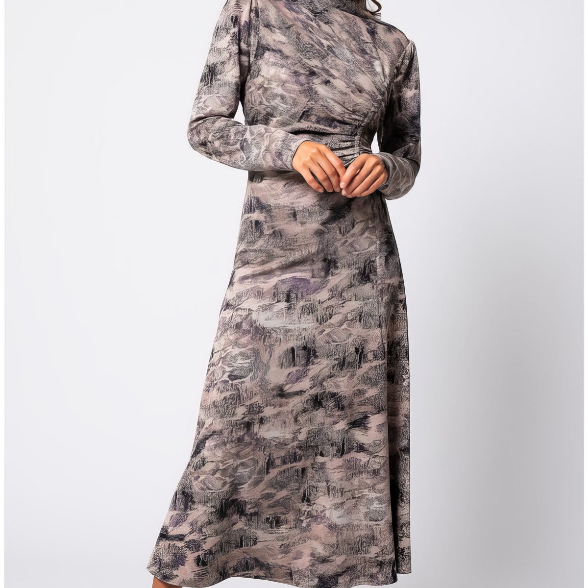 Model wearing the Brown Draped Midi Dress Mila in abstract taupe with ruched waist and long sleeves at a formal dinner setting