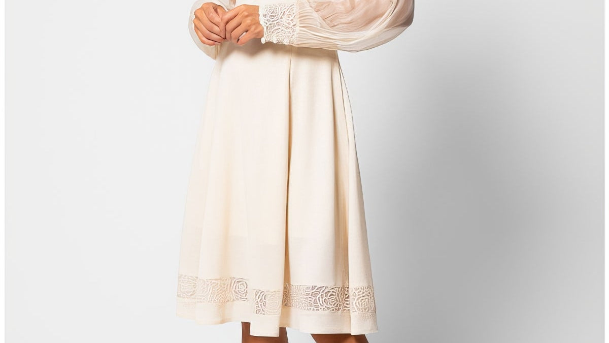 A selection of handmade European occasion gowns from Luna Fashion House including ivory lace, beige lace, navy sheath and navy off-shoulder maxi styles