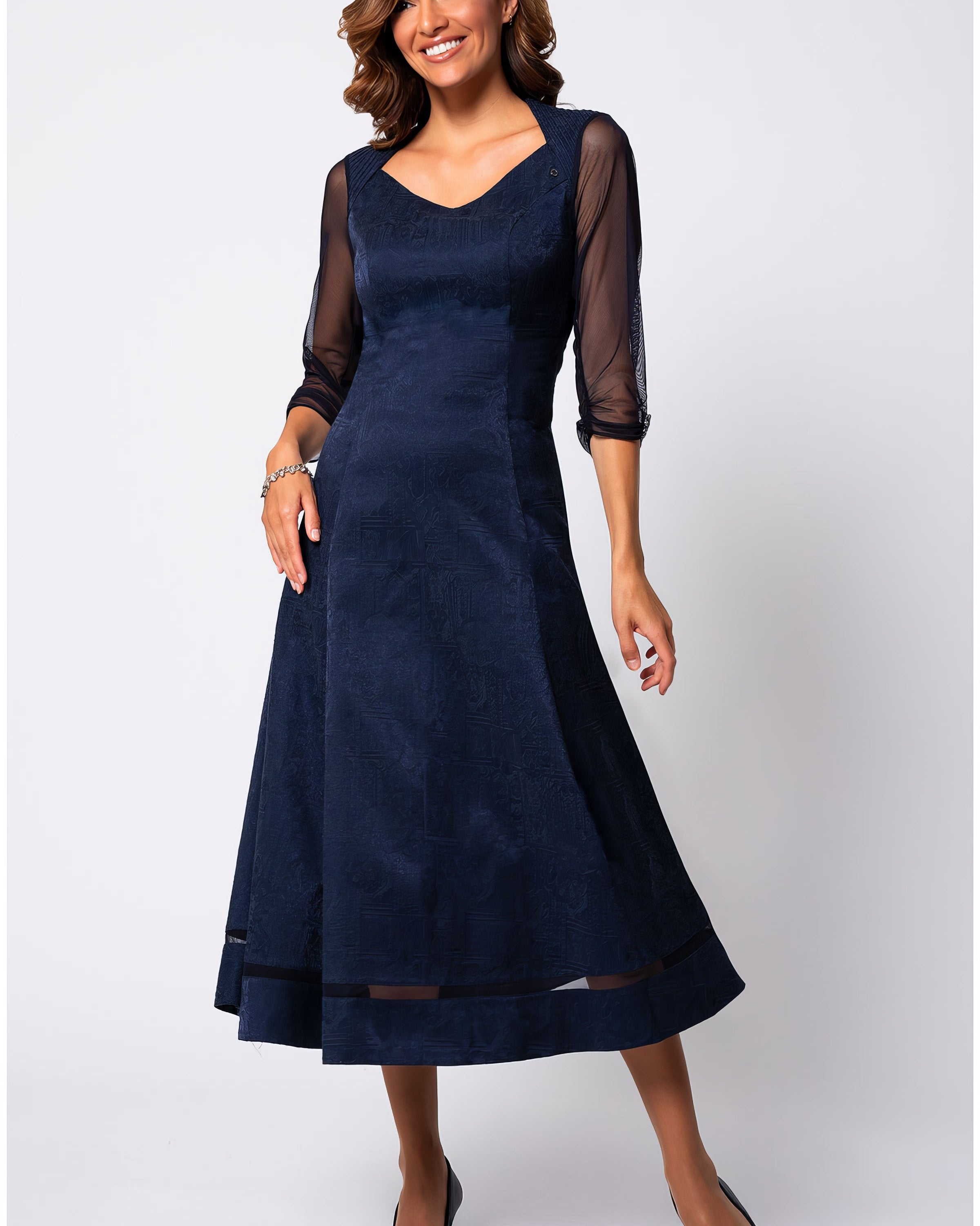 Navy jacquard midi dress with three-quarter sheer sleeves in a softly structured silhouette against a neutral studio background