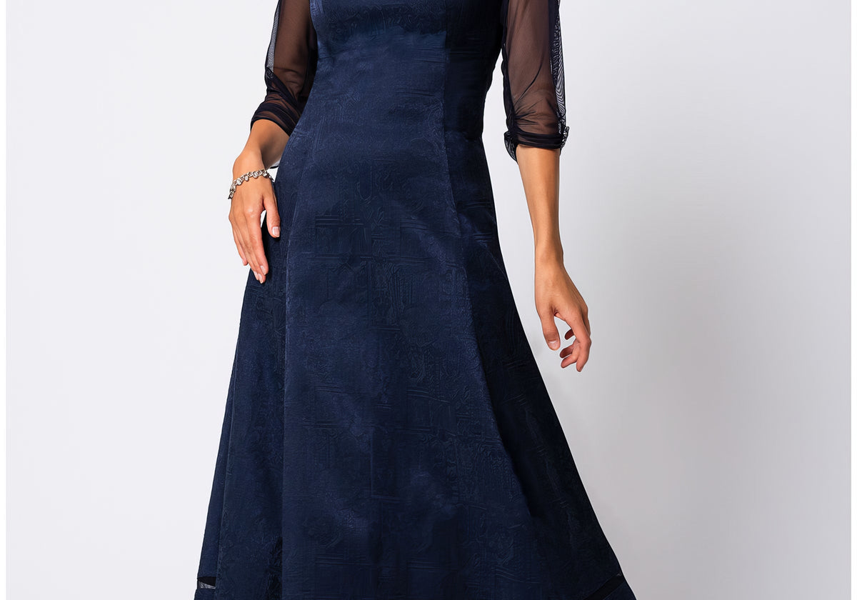 Navy jacquard midi dress with three-quarter sheer sleeves and softly structured silhouette in midnight blue for a corporate holiday party.