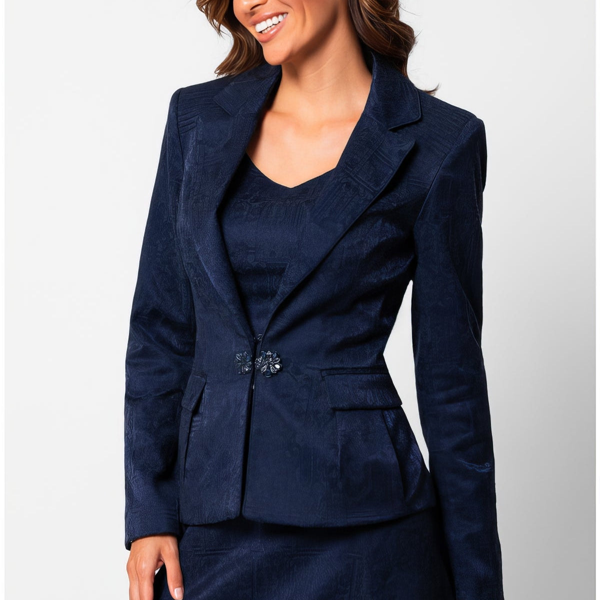 Navy jacquard blazer with notched lapels and a single ornamental clasp at the waist, worn over a matching navy dress, the Lucy tailored jacquard blazer in midnight blue by Luna Fashion House
